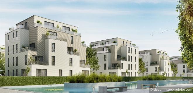 Mehrere Wohnimmobilien nebeneinander – im Fokus steht die steuerliche Behandlung von Erwerbergruppen bei der Immobiliengesellschaft.